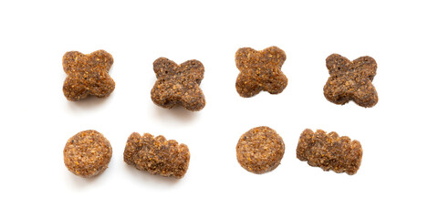 Dry pet food macro pieces isolated, cat kibble closeup, dog pellets, small protein croquettes © ange1011