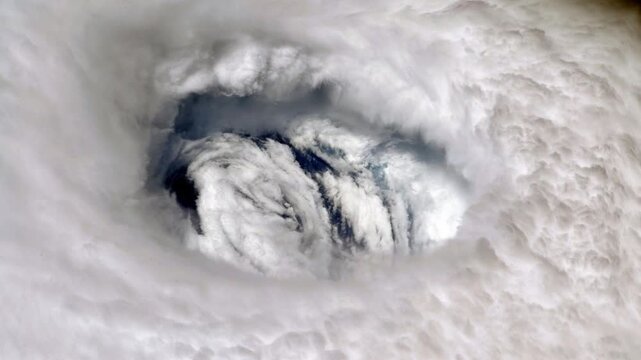 Storm swirls in aerial view, powerful and vast.