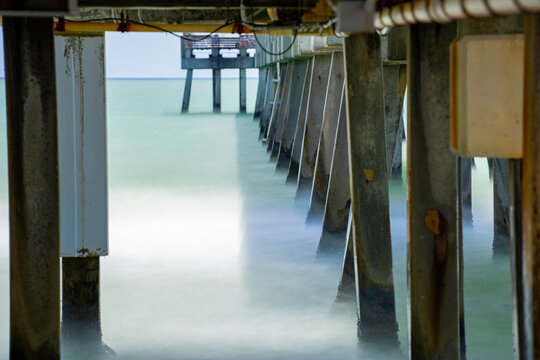 Long exposure stock image under a fishing pier Dania Beach Florida