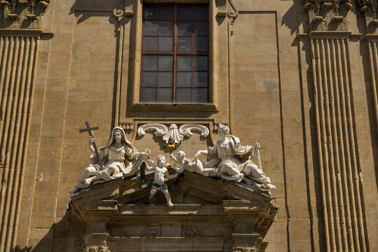 Religious statutes adorning the exterior of complesso di san firenze in Florence italy