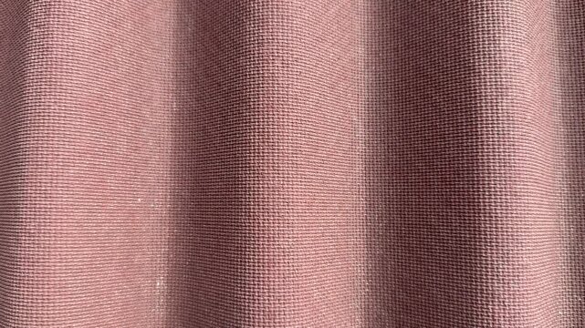 Burgundy Ondulin roof tile closeup showing rich texture and corrugated waves, detailed grain and ridges in soft sunlight, durable.