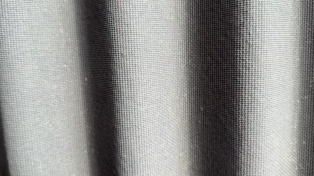 Grey Ondulin roof tiles closeup texture, closeup detail of corrugated by euroshifter sheets on cottage roof, visible granule texture