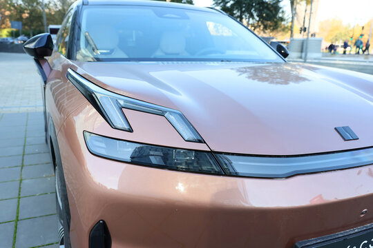 Lynk & Co 08 premium plug-in hybrid (PHEV) SUV  is parked in a public space so that it can be seen by people walking on the street in a sunny day. Romania, Bucharest, November 2025.
