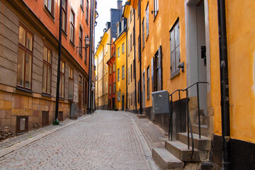 Obraz premium Colorful narrow street in Gamla Stan old town, Stockholm, Sweden