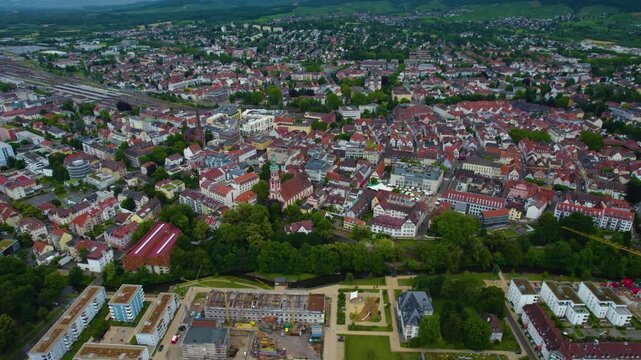 Aerial view around the city Offenburg in Germany. On cloudy day in spring beside the river Enz