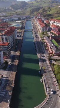 Aerial view of Rio Urola canal corridor through urban Zumaia