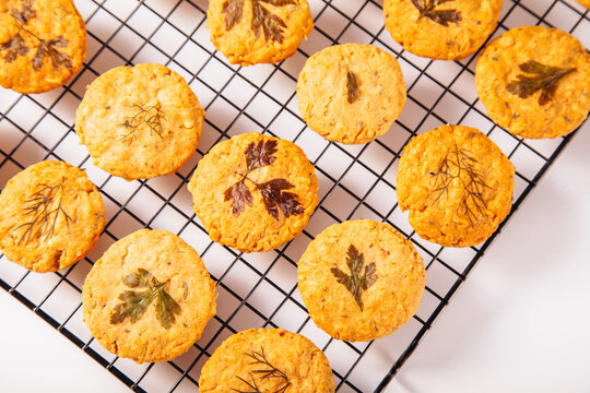Herb-infused shortbread cookies cooling on a rack