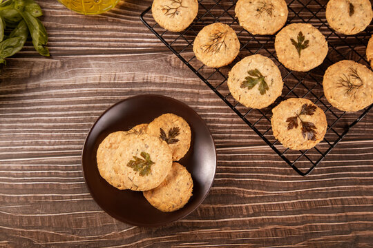 Herb and parmesan shortbread cookies on rack