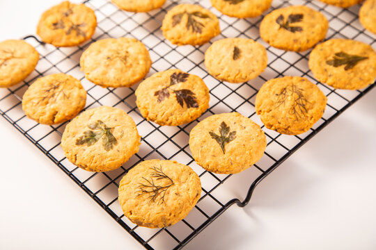 Herb-infused parmesan shortbread cookies on cooling tray