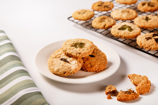 Herb-infused parmesan shortbread cookies on white plate