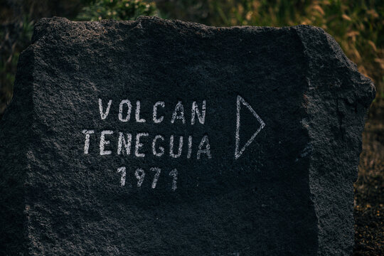 Teneguia Volcano sign on volcanic rock, La Palma
