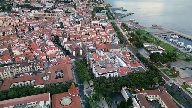 Bird&rsquo;s-eye perspective of Funchal city showing urban streets, coastal waterfront, and the vibrant layout of Madeira&rsquo;s capital