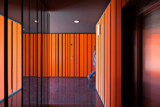 Modern corridor design with vibrant orange hues