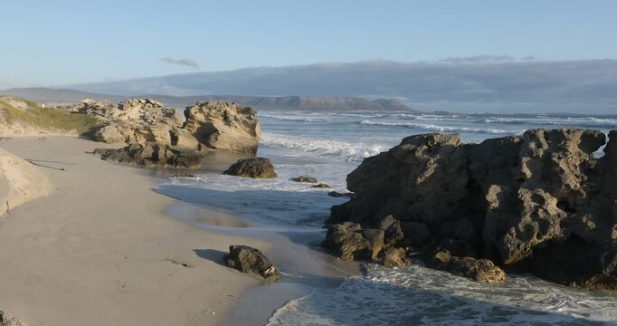teenage girl overlooking beautiful rocky coastline, Sopies Klip, Hermanus, South Africa