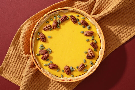 Pumpkin pie with pecan and seed topping for thanksgiving