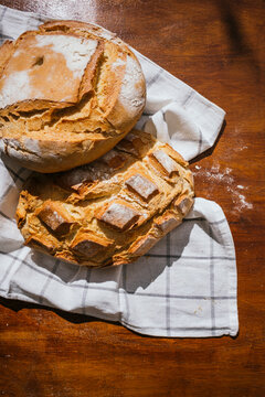 Rustic village bread on wooden table