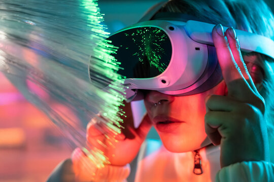 Young woman in metaverse with fiber optics