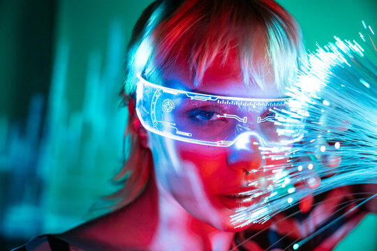 Young woman with futuristic eyewear in metaverse setting