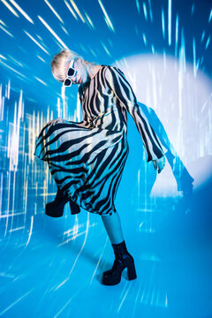Young woman in futuristic metaverse environment