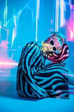 Young woman in futuristic metaverse environment