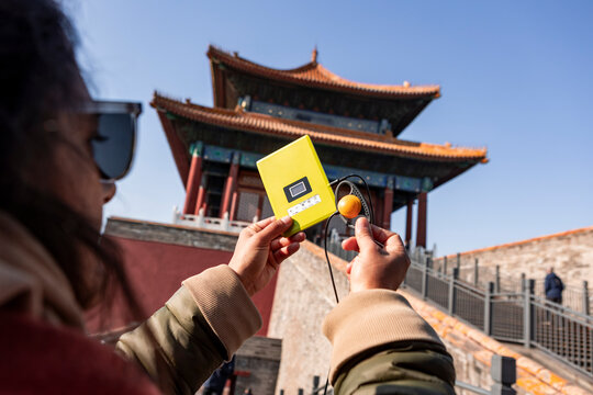 Exploring Beijing with an audio guide in hand