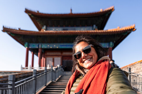 Tourist enjoying Beijing architecture in winter