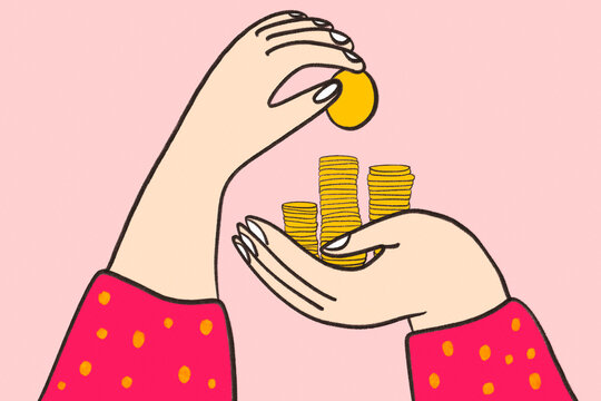 Hands stacking gold coins for finance savings contract