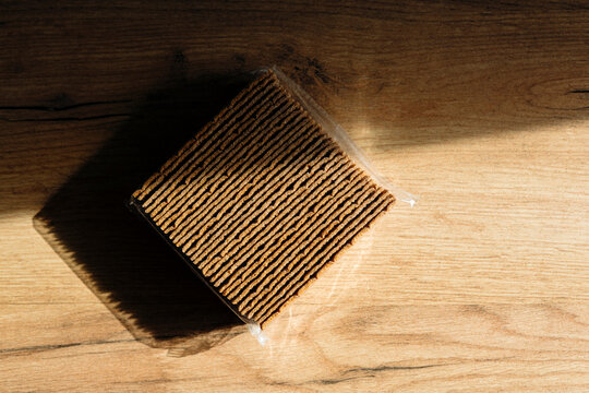 Crisp rye bread on rustic wooden surface
