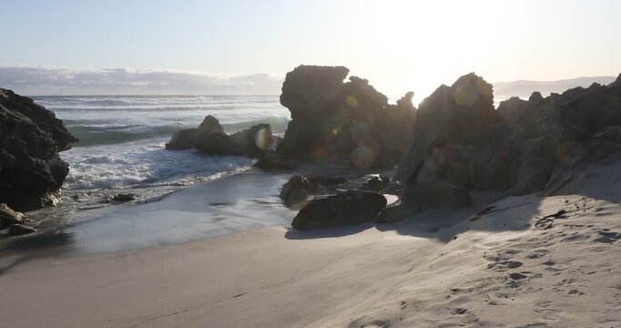 teenage girl overlooking beautiful rocky coastline, Sopies Klip, Hermanus, South Africa