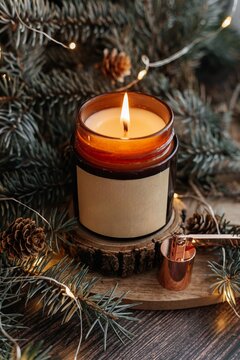 Scented soy candle with Christmas pine decoration