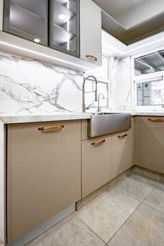 Minimalist luxury kitchen interior with marble backsplash