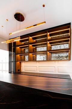Minimalist luxury interior with illuminated wood shelving