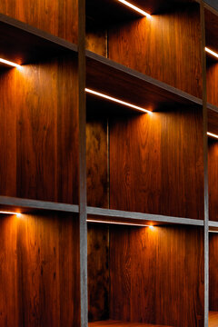 Minimalist luxury wood shelving with warm LED lighting