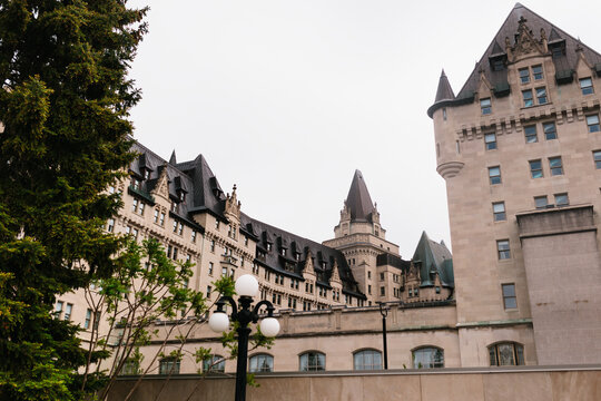 Historic ch&acirc;teau-style hotel building with turrets and sky