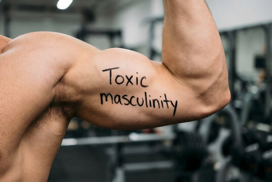 Muscular man flexing bicep with text "toxic masculinity" highlighting harmful male stereotypes