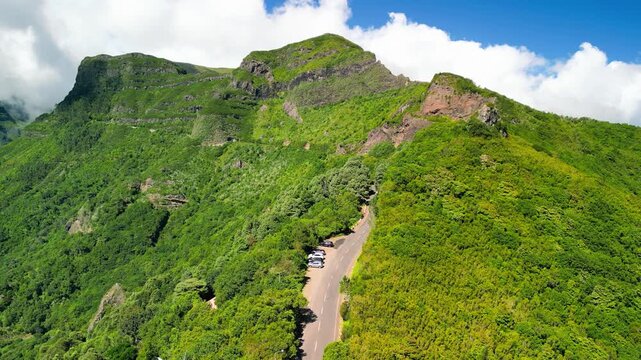 Breathtaking perspective from Encumeada viewpoint capturing Madeira&rsquo;s mountainous landscape, with deep ravines, forested slopes, and sweeping vistas from above