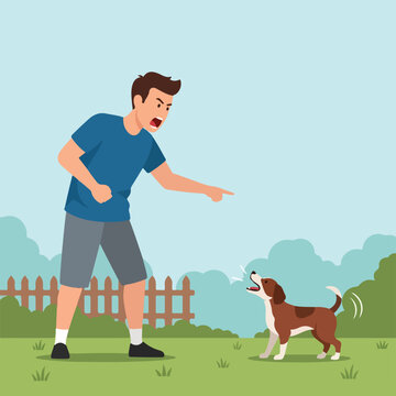 An angry man yells and points a finger at his barking dog in a backyard garden