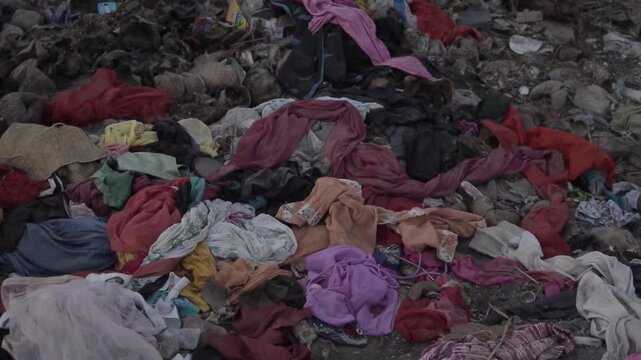 Mumbai, India - 12 february 2025: A pile of discarded clothes and textile waste, highlighting environmental pollution and waste management.