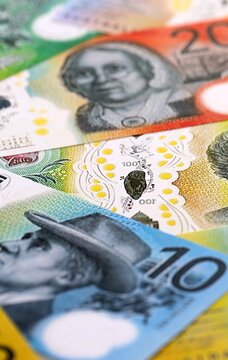Australian dollar money bills pile on table. Australia banknotes of AUD currency close up.