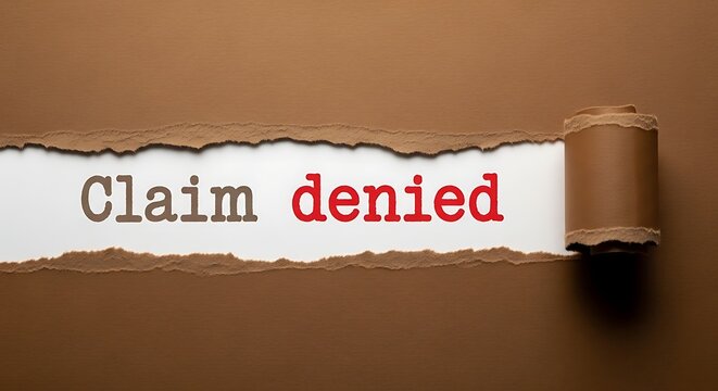 Claim denied stamp on torn paper with metallic push pin on brown background