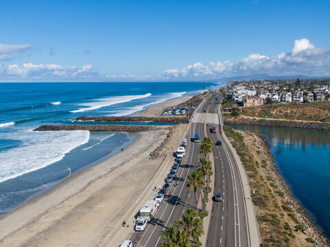 Aerial Coastal View Of Rock Jetties And Carlsbad State Beach Looking North Up The Coast In Southern California