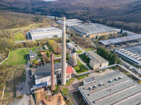 Aerial view of industrial buildings contrasting with the surrounding forest, a blend of utility and nature, PPS GROUP a.s., Detva, Banskobystricky kraj, Slovakia.