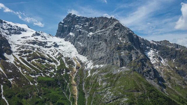 Time lapse of dancing clouds above the mountains. Mountain landscape near Engelberg, Switzerland.