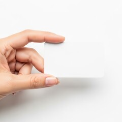 Obraz premium A hand holding a blank white business card