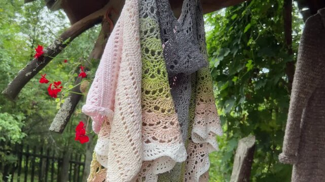 Slow tilt down shot of traditional handmade crocheted shawls in Vlkolinec UNESCO village