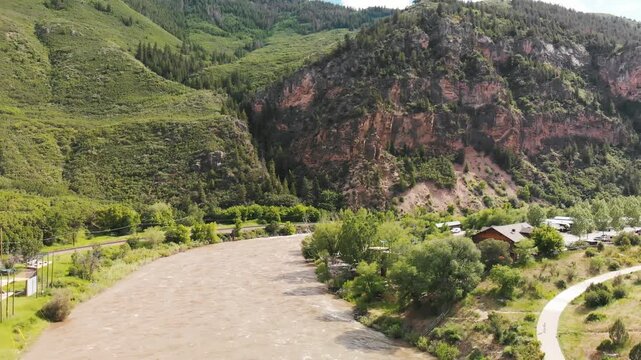 Colorado river and mountains from drone, aerial view in Moab area. Slow motion