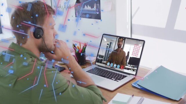 Man with headset watching laptop while caller speaking generating blue red overlays for business