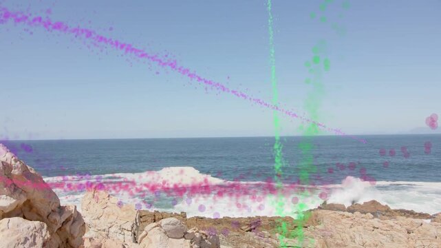 Rocky shore, waves breaking, overlay activating: pink or purple arcs, ribbon, green column showing V