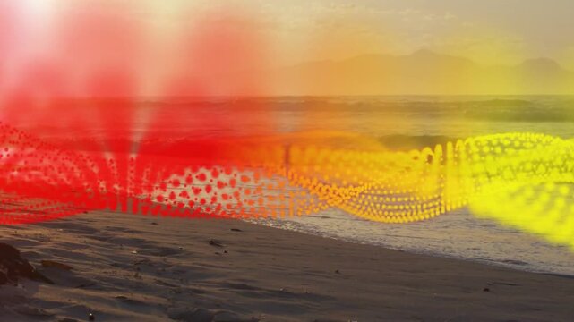 Left emergence, dot ribbon growing and converging, shifting color to visualize wave on golden shore