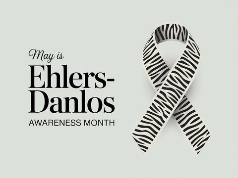 Ehlersdanlos syndrome awareness month concept with zebra striped ribbon on a light gray background
